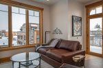 Relax & recharge after a day of adventure in the cozy living room with downtown Whitefish views.